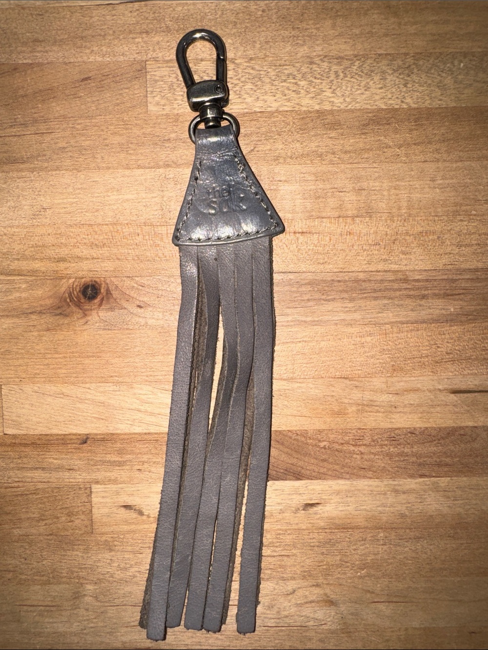 The Sak Gray Leather Tassel Keychain with Metal Clip